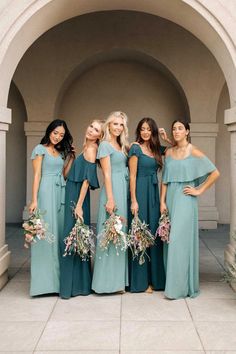 the bridesmaids are all wearing green dresses