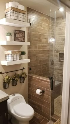 a bathroom with a toilet, shower and shelves