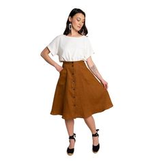 Part of our Rome Collection, the Fiore Skirt is a chic, high-waisted A-line skirt with just the right amount of flare and volume. A beginner friendly pattern with multiple variations, this elevated basic has tons of outfit potential. Available in above or below the knee lengths, the Fiore Skirt has three views. View A is a simple flared skirt with an invisible zipper at the back. View B is an asymmetrical wrap skirt with single hip pocket. View C buttons up the front with curved patch pockets. S Casual A-line Voluminous Skirt, Brown A-line Skirt For Summer, Flared Wrap Skirt With Lining For Day Out, Relaxed Brown Skirt For Day Out, Brown Relaxed Fit Skirt For Day Out, Flared Lined Skirt For Day Out, Summer Workwear Full Mini Skirt, Brown Summer Skirt For Workwear, Brown Summer Skirt For Work