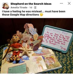 an open book with pictures on it next to a stuffed animal and some other items