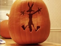 a carved pumpkin sitting on top of a table