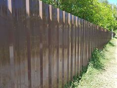 19 Metal Fence Ideas: Enhancing Your Yard with Style and Security Sheet Metal Fence, Diy Fences, Metal Fence Panels, Sloped Yard, Fencing Material