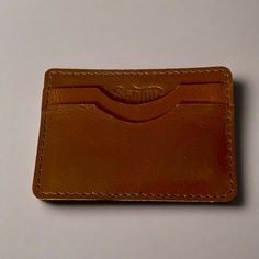 Forget the bulky leather wallet; this slim card case wallet will fit in any pocket. The perfect combination of form and function, this stylish leather card holder is all you need daily. Material: Genuine Leather Color: Teal or Brown Dimensions: Width: 3.8"Height: 2.75" Note: Color discrepancies may occur between this product and your computer screen. Casual Card Holder With Coin Pocket, Casual Rectangular Card Holder With Coin Pocket, Leather Card Holder With Card Slots, Leather Card Holder With Slots, Casual Leather Card Holder With Interior Slots, Casual Card Holder Gift, Casual Card Holder As Gift, Casual Brown Rectangular Card Holder, Classic Card Holder With Interior Slots For Personal Use