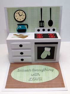 a card with an oven, stove and clock on it