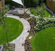 an aerial view of a garden with green grass