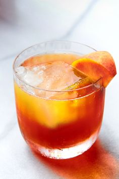 a drink with an orange slice on the rim