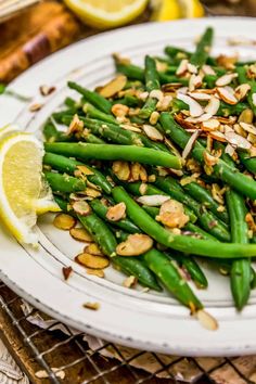 asparagus with almonds and lemon on a plate