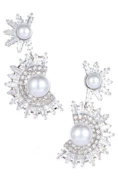 Elevate your elegance with our Floral Rhinestone Pearl Earrings. These exquisite earrings feature a captivating combination of floral motifs, sparkling rhinestones, and lustrous pearls, creating a timeless and charming accessory. Crafted with high-quality materials, they not only enhance your allure but also add a touch of sophistication to any look. Perfect for weddings, cocktail parties, or a romantic night out, these earrings are the ideal choice to make a statement and shine with grace. Party Pearl Drop Crystal Earrings In Cubic Zirconia, Party Crystal Earrings With Pearl Drop And Cubic Zirconia, Cubic Zirconia Crystal Earrings With Pearl Drop For Party, Party Pearl Earrings With Sparkling Stones, Glamorous Pearl Earrings For Party, Pearl Earrings With Sparkling Stones For Parties, Party Pearl Earrings With Cubic Zirconia, Pearl Jeweled Earrings For Party, Silver Jeweled Pearl Earrings