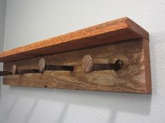 Rustic reclaimed barnwood and railroad spike coat rack by Perryhill Rustics Barnwood Coat Rack, Railroad Spikes Crafts, Entry Shelf, Barnwood Shelves, Rustic Entry, Rustic Wall Shelves, Entryway Coat Rack, Rustic Coat Rack, Rustic Wooden Shelves