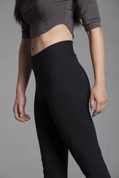 The high waist, slight flair, and curved seams on these ethically sourced, sustainable workout pants are sleek and flattering. They accentuate and enhance the natural curves and musculature of the body. Made out of organic cotton/soy french terry, the Ellipse Pants let your body breathe while keeping you warm.  Great pants for exercising, stretching, lounging,and travel!  Features include a thick waistband that can be folded over for a low-rise look and a slightly tapered bottom for a practical Sitting Yoga Poses, Organic Yoga Clothes, High Waisted Black Leggings, Black Yoga Pants, Clothes Black, Fitness Leggings, Black Yoga, Yoga Pants Outfit, Organic Clothing