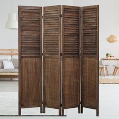 a room divider made out of wood with shutters