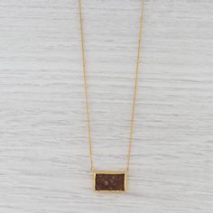 "This lovely new pendant necklace is an authentic Nina Nguyen piece. This necklace has a retail price of $295. Gem: Natural Sand Druzy Quartz Metal: Sterling Silver, 22k Gold Vermeil Weight: 8.3 Grams Stamps: Nina Nguyen 925 Nina N Style: Bead Accented Curb Chain - Adjustable Closure: Spring Ring Clasp Chain Length: 16 - 18\" Width: 1.8 mm Pendant dimensions: 15.5 x 22.5 mm Each piece is thoroughly examined and refinished as needed by our professional jewelers, graded by our in-house GIA (Gemolo Brass Necklace With Adjustable Chain And Rectangular Pendant, Elegant Rectangular Brass Necklace, Brown Rectangular Pendant Necklace As Gift, Yellow Gold Amulet Necklace With Rectangular Pendant, Gold Rectangular Amulet Necklace, Brown Brass Amulet Necklaces, Elegant Brown Brass Necklace, Rectangular Large Pendant Amulet Necklace, Quartz Pendant Necklace