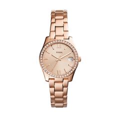 Perfect for any occasion, this ladies' Scarlette Mini rose-toned crystal-accented watch from Fossil is a sparkling to-go look you'll love to wear. The rose-toned sunray dial features three hands, roman numeral markers and a date display. 32.0mm rose-toned stainless steel case with mineral crystal and a crystal-lined bezel Quartz movement keeps accurate time. The rose-toned stainless steel link bracelet secures with a fold-over clasp. Water resistant to 50 meters, this watch includes a 2-year lim Fossil Watch, Hand Watch, Fossil Watches, Rose Gold Case, Rose Gold Watch, Sparkling Crystal, Women's Watch, Steel Watch, Classic Silhouette