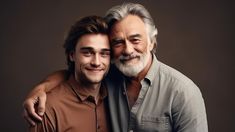 an older man and younger man are posing for a photo with their arms around each other