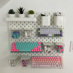 a computer keyboard and mouse on a pegboard with other office supplies attached to it