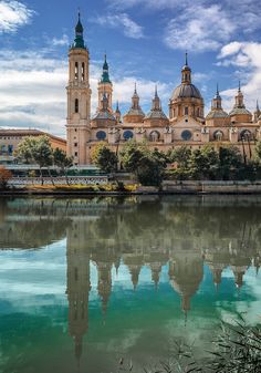 a large building sitting on top of a river