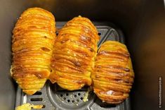 three croissants sitting in an air fryer