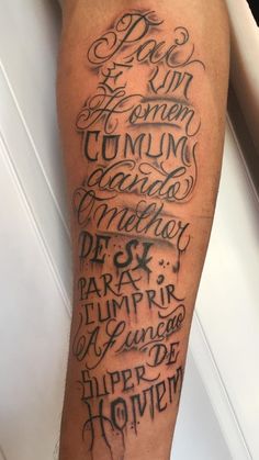 a man's leg with some writing on it