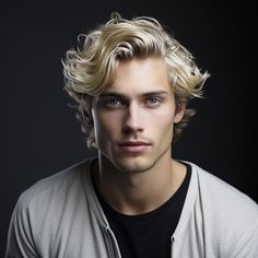 a young man with blonde hair is looking at the camera