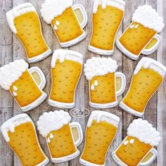 beer themed cookies are arranged in the shape of mugs