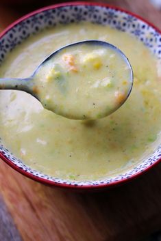 a spoon in a bowl filled with soup