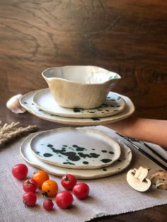 a table topped with plates and bowls filled with food