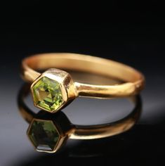 AAA Natural Green Peridot Hexagon Ring, 14K Solid Gold Jewelry, Stacking Ring, Simple Dainty Ring, Boho Jewelry, Gift For Her, Birthday Gift Specifications :- * Material            :        Gold, Gemstone * Stone Name    :        Natural Peridot * Stone Size       :        5X5 mm * Ring Weight     :       1.40 Gm. Approx *All of our jewelry are hand made and made to order. *We use only 10K or 14k real gold. "Not Plated or Filled" Shipping Handling Time :     We Take no handling time, We ship to Octagon Yellow Gold Rings For Gift, Yellow Gold Octagon Rings For Gift, Yellow Gold Octagonal Rings For Gifts, Gold Peridot Jewelry With Emerald Cut, Fine Jewelry Octagon Stackable Rings, Gold Faceted Emerald Ring As Gift, Gold Faceted Emerald Ring Gift, Gold Stackable Rings With Peridot Birthstone, Faceted Gold Emerald Ring Gift