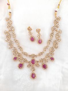 Rare Find Premium AD Studded Double Layered Necklace Set With Ruby Red Stones an elegance a must-have Statement necklace The stunning petite necklace's elegant leaf style can go with any outfit, enhancing the attire to give it a premium look. It's adorned with Ruby and premium AD stones giving it a graceful look. Please be advised of slight color variations due to light effects. Ruby AD necklace /polki Necklace / Indian Necklace/Indian Wedding Necklace/Indian jewelry Bridal SetIndian Choker/Indi Red Necklaces With Elegant Design, Red Necklace With Elegant Design, Formal Red Necklace With Elegant Design, Elegant Red Drop Necklace, Elegant Red Necklace, Indian Wedding Necklace, Petite Necklace, Red Stones, Polki Necklace