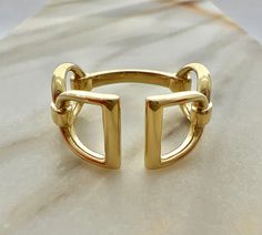 Simply Elegant. Our Point-To-Point ring in luxurious high polished 18k yellow gold. This beautifully proportioned ring is inspired by the classic English stirrup & snaffle bit. Named after the original steeple chase term. A race run between two points, usually church spires, i.e. Point-To-Point. A very comfortable to wear everyday ring. Gorgeous on its own, or paired with our Diamond Stack Rings and Slim Lace Rein Rings. Everyday Equestrian Luxury. 18 karat yellow gold 10mm at widest point Handm Steeple Chase, Rings Everyday, Stack Rings, Snaffle Bit, Diamond Stacks, Everyday Ring, Everyday Rings, Stirrups, Stacking Rings