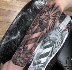 a man with a lighthouse tattoo on his arm