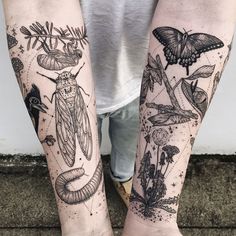 two people with tattoos on their legs, one is holding a butterfly and the other has moths