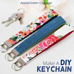 two keychains with flowers on them and the words make a diy key chain