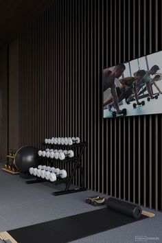 an exercise room with black and white striped walls