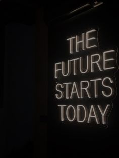 a neon sign that says the future starts today