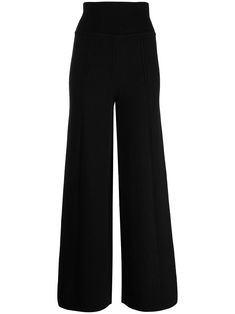 Black wool wide-leg wool trousers from GALVAN featuring knitted construction, wide leg, high waist, ribbed waistband and ribbed hem. POSITIVELY CONSCIOUS: We've partnered with Good On You — an ethical agency that rates how sustainably brands perform across various people, planet and animal welfare criteria. This product comes from a Conscious brand that performs well in relation to their impact on animals.. Campus Fashion, Knitted Leggings, Knitted Trousers, Wool Leggings, Chain Strap Bag, Floral Shoes, Wool Trousers, High Rise Pants, Scarf Men