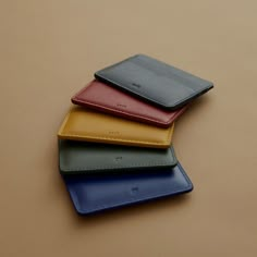 The slimline cardholder is the ideal piece for anyone who wants all their essential cards in one compact arrangement. The geometric cut details allow you to store at least five cards with ease. Made using soft full grain leather that is dyed in house. Business Mood Board, Desk Gadgets, Cardholder Wallet, Mens Gadgets, Leather Cardholder, Clothing Board, Return Gifts, Bold Color Palette, Luxury Packaging