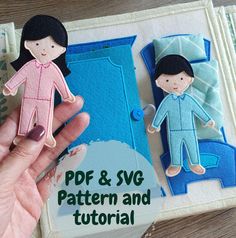 a hand holding a paper doll next to a book with the title pdf & svg pattern and tutorial