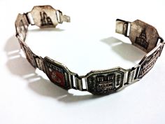 1930s Art Deco bracelet depicting iconic Parisian landmarks. In good condition, with some enamel loss, wear, and tarnish. Paris Souvenirs, French Paris, Art Deco Bracelet, 1930s Art, 1930s Art Deco, Antique Metal, Bracelet Silver, Pure Silver, Silver Bracelets