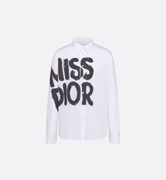 A staple Dior silhouette, the blouse features the black Miss Dior Graffiti motif, a nod to the 1967 debut ready-to-wear collection and a manifesto to Maria Grazia Chiuri's signature celebration of feminism. Crafted in white cotton and silk poplin, it is elevated by cuffs embellished with a vintage-inspired gold-tone Christian Dior Paris signature button. The blouse can be paired with other Miss Dior Graffiti creations to complete the look.. 36 Dior Silhouette, Denim Swimsuit, Christian Dior Paris, Dior Star, Style Moodboard, Dior Paris, Icon Shoes, Stole Scarf, Maria Grazia Chiuri