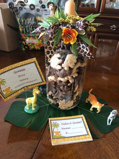 a jar filled with lots of treats on top of a table