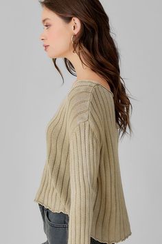 This versatile pullover sweater is featured in a mid length silhouette and wide ribbed knit fabrication. This classic staple fitted with a scoop neckline and a delicate hemline is the perfect upgrade to your capsule wardrobe. Product Details Material: 55% Acrylic, 45% Cotton. Fit: True to size, relaxed fit. Body length: 20" from shoulder to hem (size Small). Fabric: Soft wide rib knit. Features: Scoop neck, relaxed body, bell sleeves, hi-low hem, wide rib knit pattern. Model: 5'9" / Wearing a si Spring Ribbed Sweater, Casual Scoop Neck Knit Sweater, Casual Knit Sweater With Boat Neck, Casual Boat Neck Knit Sweater, Spring Knit Sweater With Ribbed Neckline, Knit Sweater With Ribbed Neckline For Spring, Chic Fall Knit Top With Scoop Neck, Spring Boat Neck Knit Top, Spring Knit Boat Neck Top