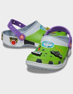 This Product Is Excluded From All Promotional Discounts And Offerscrocs X Disney Pixar Toy Story Buzz Lightyear Classic Clogs. Attention Star Command! The Exclusive Buzz Classic Clog Has Crash Landed On A Strange Planet. This Limited-Edition Style Features A Fully Wrapped Print Design Inspired By The Iconic Space Ranger Costume, Including Four Exclusive Jibbitz™ Charms. These Clogs Also Feature The Beloved “andy" Signature On The Inside Sole. Buzz Costume Printed Wrap Design. Includes 4 Exclusive Buzz-Themed Jibbitz™ Charms. Incredibly Light And Fun To Wear. Water-Friendly And Buoyant; Weighs Only Ounces. Ventilation Ports Add Breathability And Help Shed Water And Debris. Easy To Clean And Quick To Dry. Pivoting Heel Straps For A More Secure Fit. Customizable With Jibbitz™ Charms. Iconic C Toy Story Crocs, Space Ranger Costume, Buzz Costume, Cool Crocs, Ranger Costume, Strange Planet, Space Ranger, Toy Story Buzz Lightyear, Toy Story Buzz