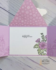 a close up of an open card with flowers on it and the words happy birthday