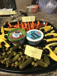 an assortment of vegetables and dips on a platter with a note that says happy birthday