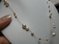 This is much more substantial than meets the eye. beautiful color on the pearls. Adjustable Pearl Drop Necklace For Anniversary, Adjustable Pearl White Pearl Necklace For Anniversary, Adjustable Pearl White Necklace For Anniversary, Eye Beautiful, Knot Earrings, Woven Bracelets, Crown Jewels, The Eye, Pave Diamonds