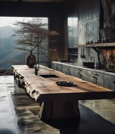 a large wooden table sitting in the middle of a kitchen next to an oven and sink