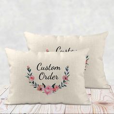 two pillows with the words custom order printed on them, sitting next to each other