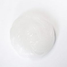 a white round object on a white surface