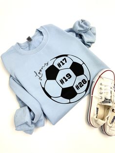 Custom Soccer Ball with Team Name and Jersey Number. Soccer Team Hoodie. Soccer Mom. Personalized Soccer Sweatshirt with Number, Soccer Mama This listing is for one ultra soft UNISEX FIT sweatshirt that features our customizable soccer ball design printed on the front chest. *Cotton / Poly Construction *Crew Neck *Unisex sizing *Nice warm thickness, definitely not a thin sweatshirt! PLEASE NOTE DUE TO INVENTORY SHORTAGES NATIONWIDE, WE MAY USE COMPARATIVE SUBSTITUTES FOR YOUR ORDER, WHICH MEANS SOMETIMES THE SHADES OF COLOR WILL VARY SLIGHTLY DEPENDING ON BRAND WE USE!!  LETTERING COLOR: White or Black (please leave a note with desired lettering color during checkout. If no note is left, we will choose for you.) Check out our policy page for return / exchange information as well as shippin Soccer Ball Design, Soccer Sweatshirt, Jersey Numbers, Soccer Mom Shirt, Ball Design, Soccer Mom, Mama Sweatshirt, Team Name, Workout Sweatshirt