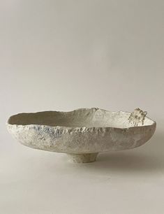 a white bowl sitting on top of a table